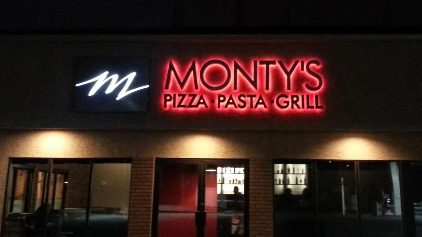 Exterior of Monty's Pizza pizza restaurant on Potter Greens Dr NW in Edmonton, AB